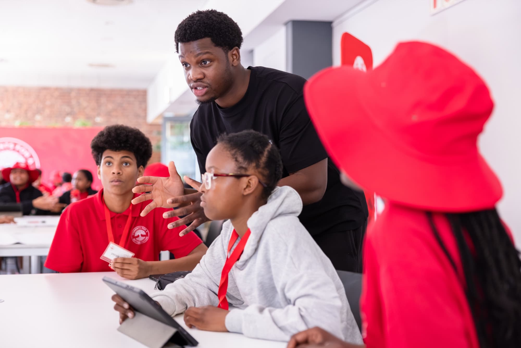 David facilitating a hackathon table of students